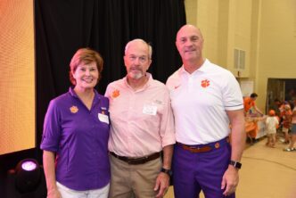 Amy and Micky Scott are with Clemson President James P. Clements at Saturday's College of Agriculture, Forestry and Life Sciences tailgate.