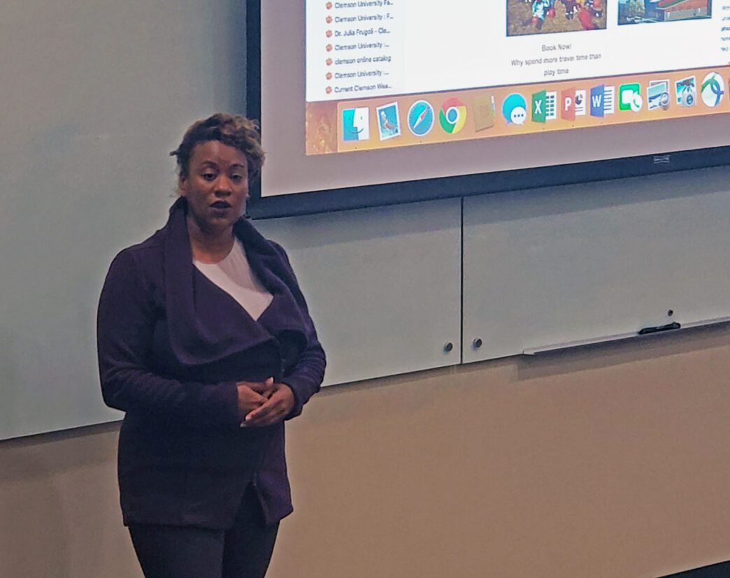 Marshall speaks to auditorium.