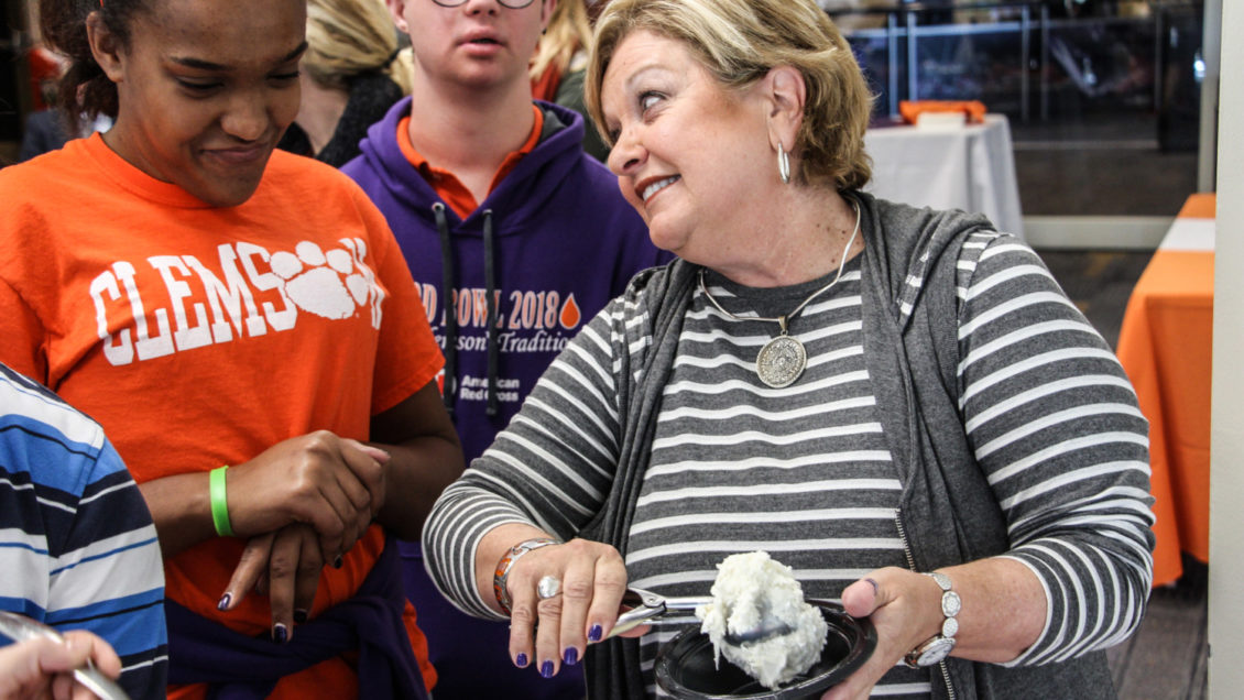 Vice President for Student Affairs Almeda Jacks serving ice cream to students from the ClemsonLIFE program.