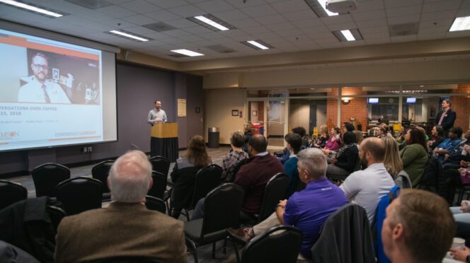 Brennan Beck speaking before a group of colleagues in Hendrix Student Center on Nov. 15, 2018