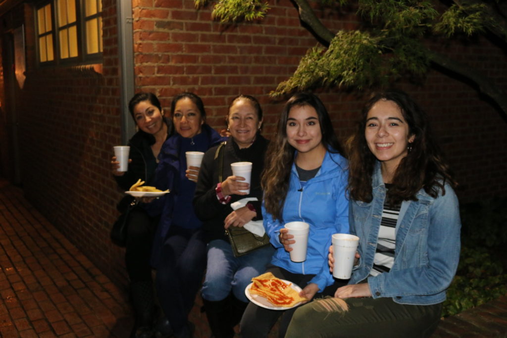These ladies enjoy food they bought from the food truck and food tent during Clemson's first-ever Day of the Dead celebration.