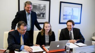 MBA director Greg Pickett joins cohorts as they prepare for a negotiation session