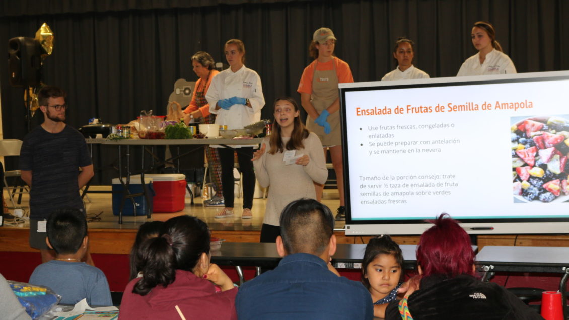 Clemson students involved with the Culinary Nutrition and the Physical Activity Promotion and Research Creative Inquiry projects share healthy eating tips in both English and Spanish to Monaview Elementary School parents and students.