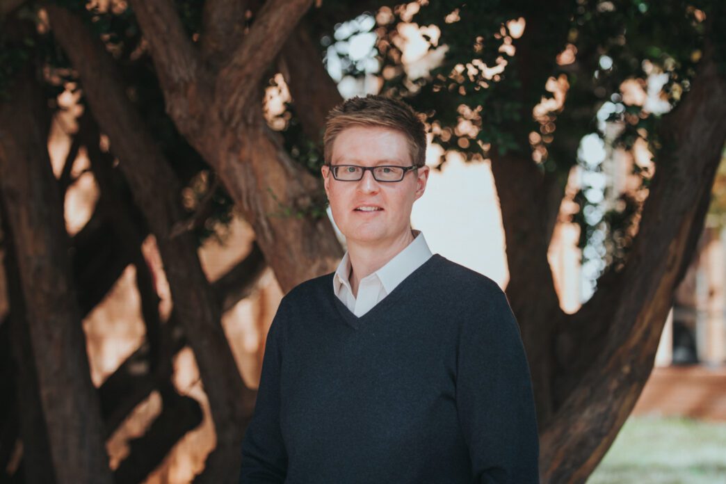 John Morganstern stands in front of a tree.