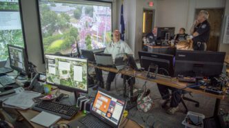 Members of Clemson's emergency operations team at unified command during a football gameday.