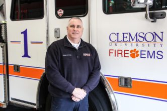 Bill Daniel, chief of Clemson Fire/EMS, in front of a fire truck at the Perimeter Road station on Dec. 6, 2018.