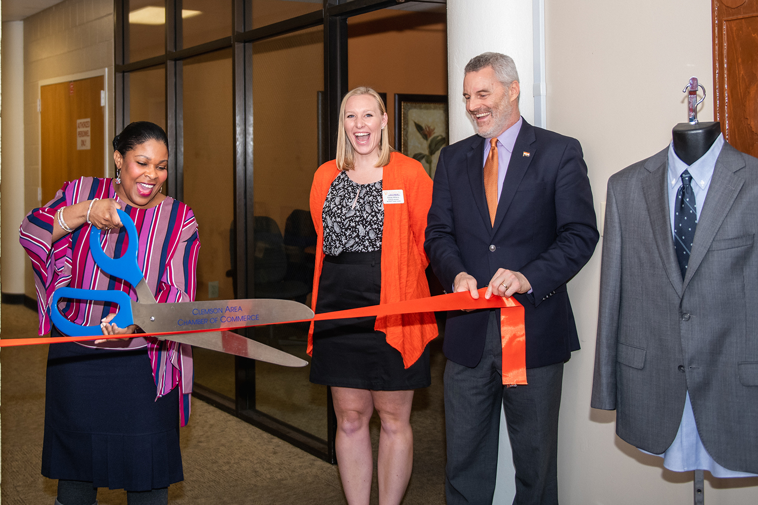 Members of the Career Center cut the ribbon for the grand opening of the CUSG Clothes Closet, which offers business attire to students free of charge.
