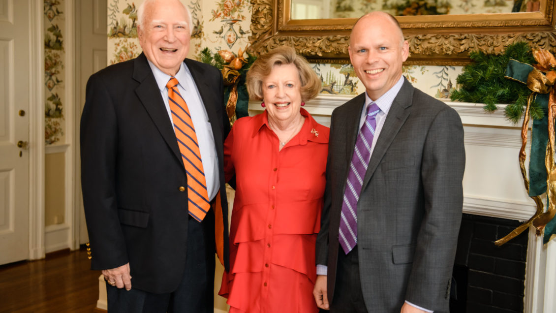 Bill Sturgis, left, and his wife, Martha Beth, celebrated at the Poinsett Club in Greenville with Scott Husson, right.