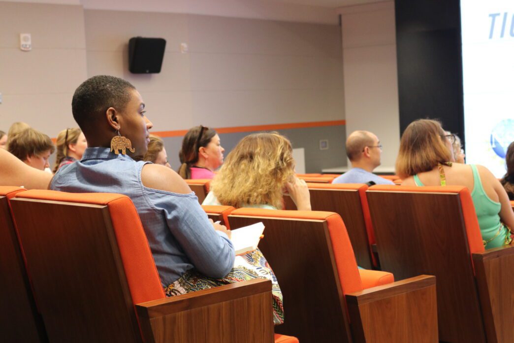 Auditorium filled with people.