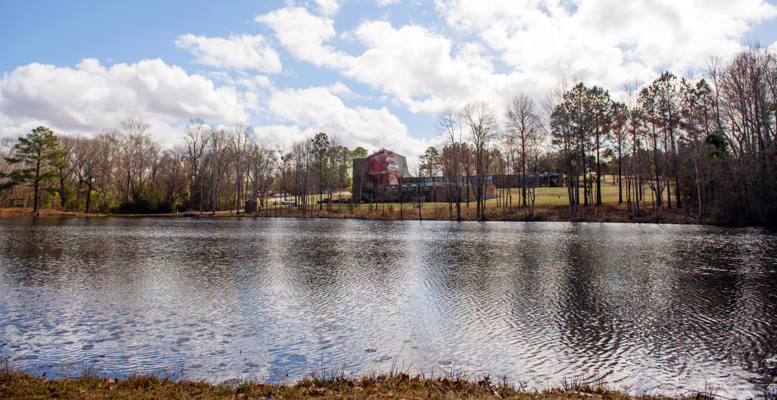 The main building at Sandhill REC is pictured from across the pond behind it.