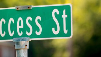 Street sign with the name "Success Street."