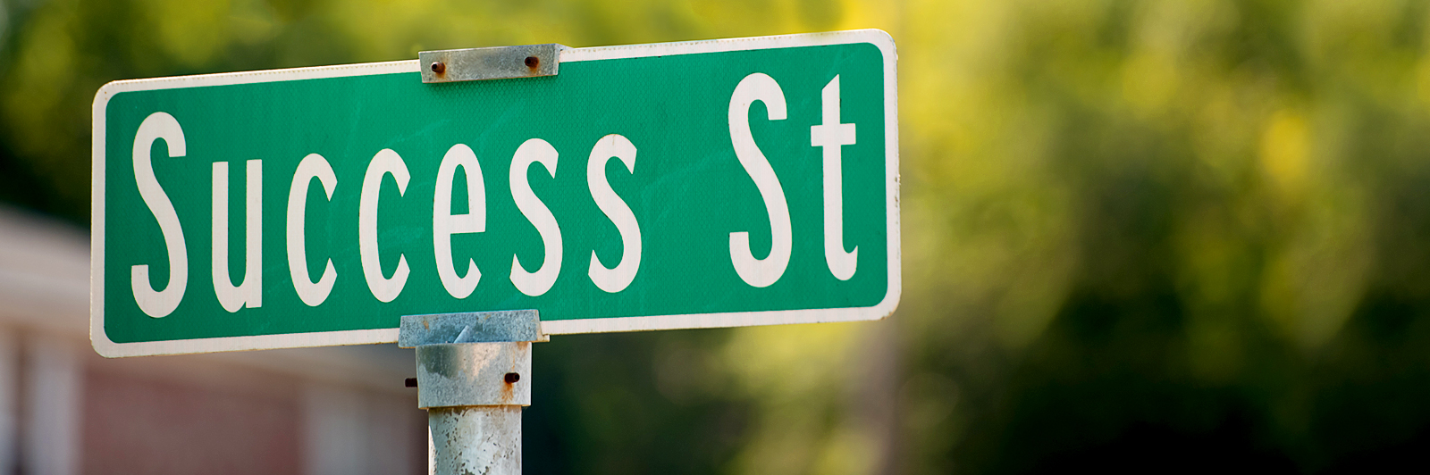 Street sign with the name "Success Street."
