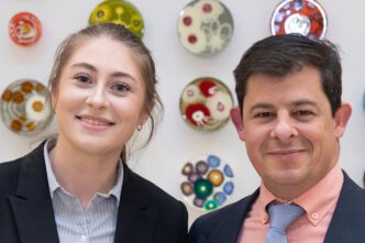 Chemistry undergrad Lauren Skrajewski stands with her advisor, Dr. Carlos Garcia, inside the Life Sciences Facility.