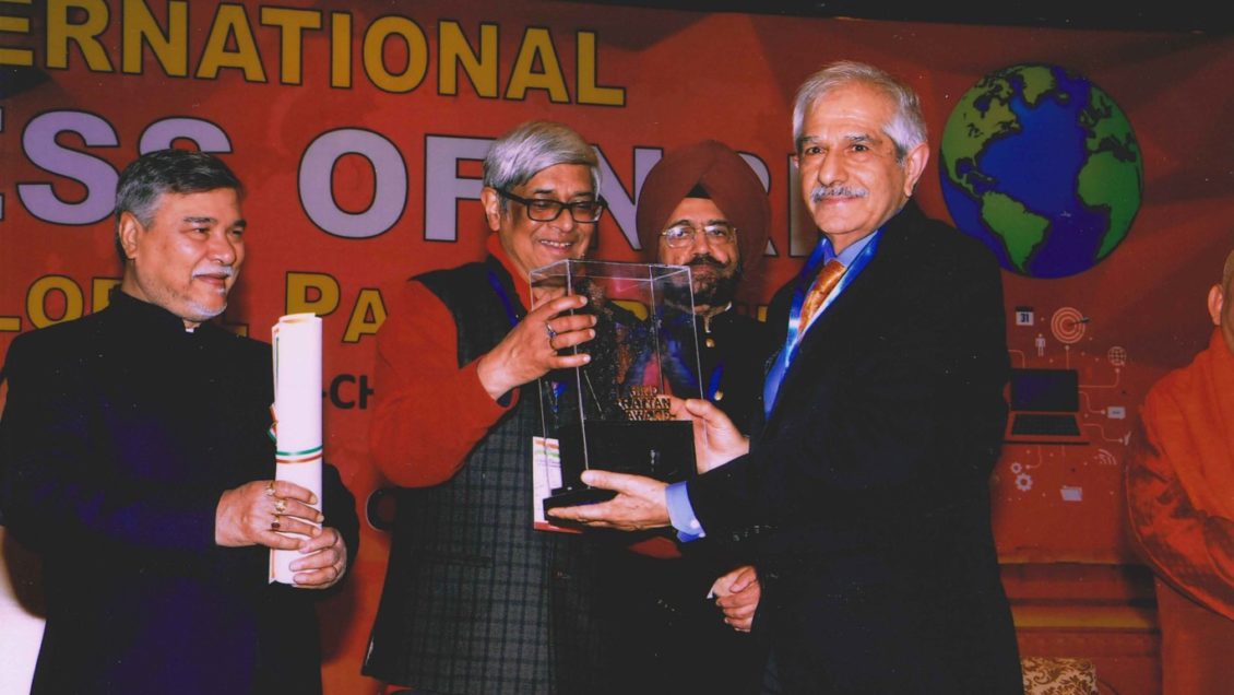 Rajendra Singh, far right, accepts his 2019 Hind Rattan Award.