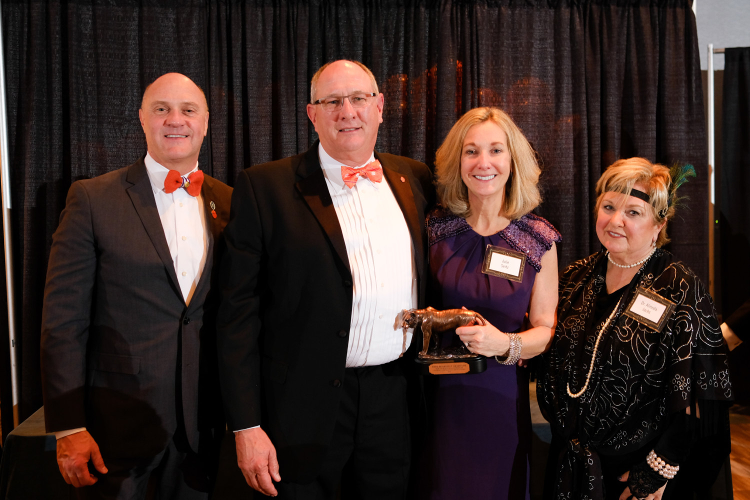 Jay and Julie Seitz receive an award as generous donors at the 2019 Student Affairs Gala from President Jim Clements (left) and Almeda Jacks (right).