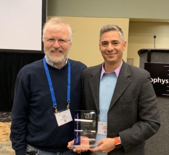 College of Science physicist Hugo Sanabria (right) is presented the award by Claus Seidel of Heinrich Heine University.