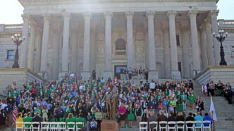 Group at Legislative Day watches for the State House steps.