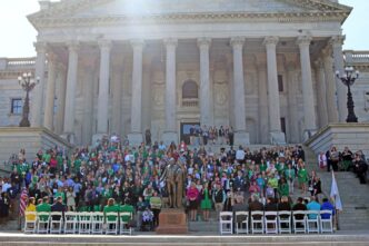 Group at Legislative Day watches for the State House steps.