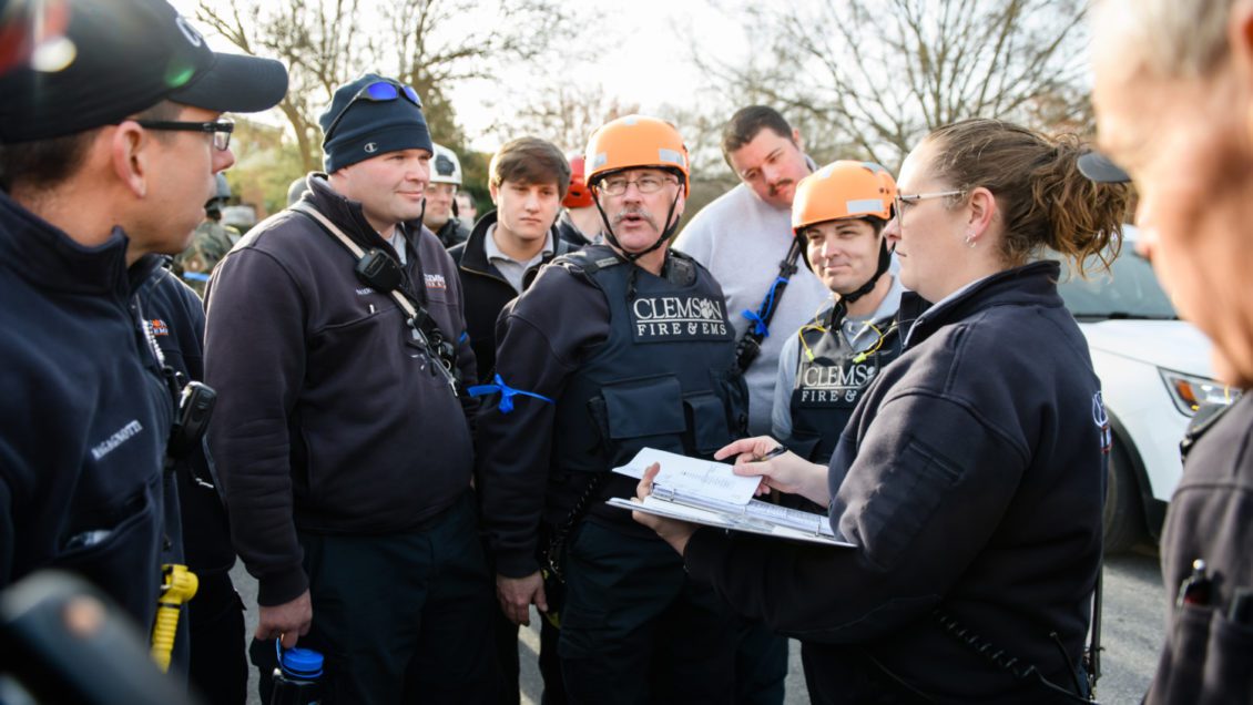 Jessica Landreth of Clemson University Fire Department provides instructions to a team on March 19 as part of an active shooter exercise on campus.