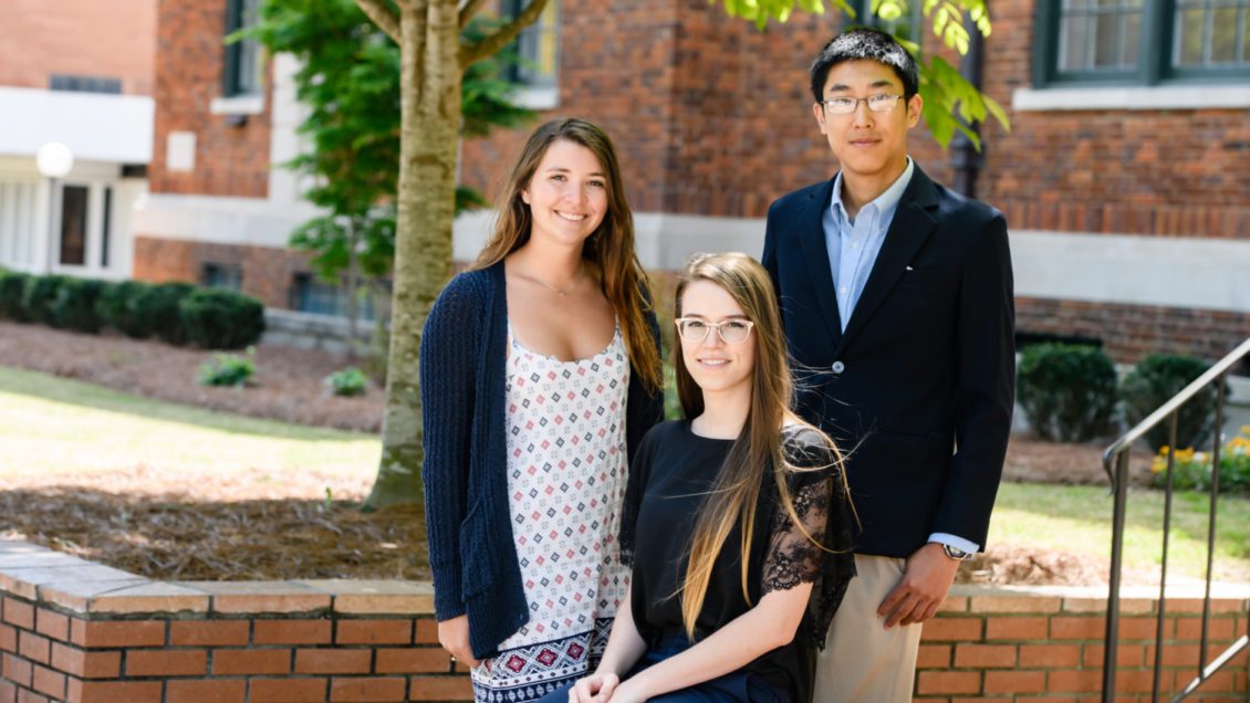 The three Clemson University seniors who were offered Graduate Research Fellowships from the National Science Foundation were: (from left) Sarah Elizabeth Sandler, Sallye Rose Gathmann and Hansen Mou. They are standing in front of Riggs Hall.