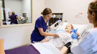 Nursing students practice running scenarios in the newly renovated simulation space in Edwards Hall.