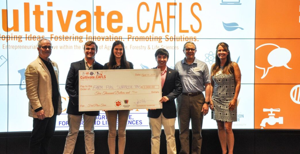 First-place team with prize winnings.