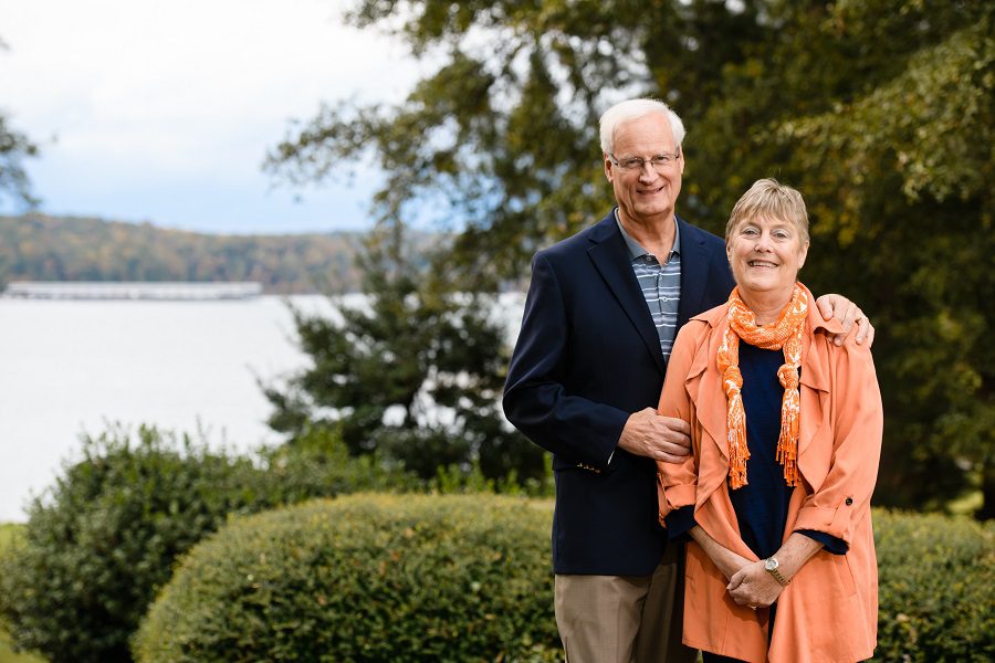 Clemson donors John and Laurie Gutshaw stand in front of Lake Hartwell