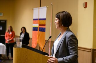 Associate Dean for Undergraduate Studies and Faculty Affairs, Denise Anderson, addresses CBSHS faculty and staff at the annual awards ceremony.