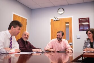 From left: Timothy Fulford of Trident Technical College, Joe Santaniello of Spartanburg Community College, Christopher Kitchens of Clemson University and Shawn Masto of Spartanburg Community College meet in Clemson University’s Earle Hall to plan SPECTRA, a program that makes $3 million in new scholarships available to students who transfer from technical colleges to Clemson to study engineering or computing.
