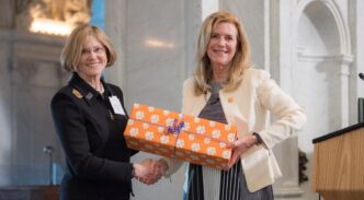 Dean Wendy York presents symbolic package of videos at Library of Congress