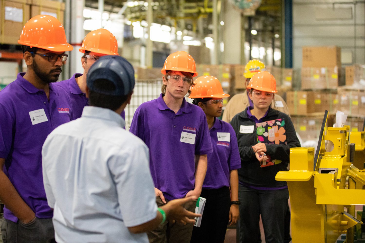 Ben Snelson, center, developed an eye for energy efficiency by touring several manufacturing plants.