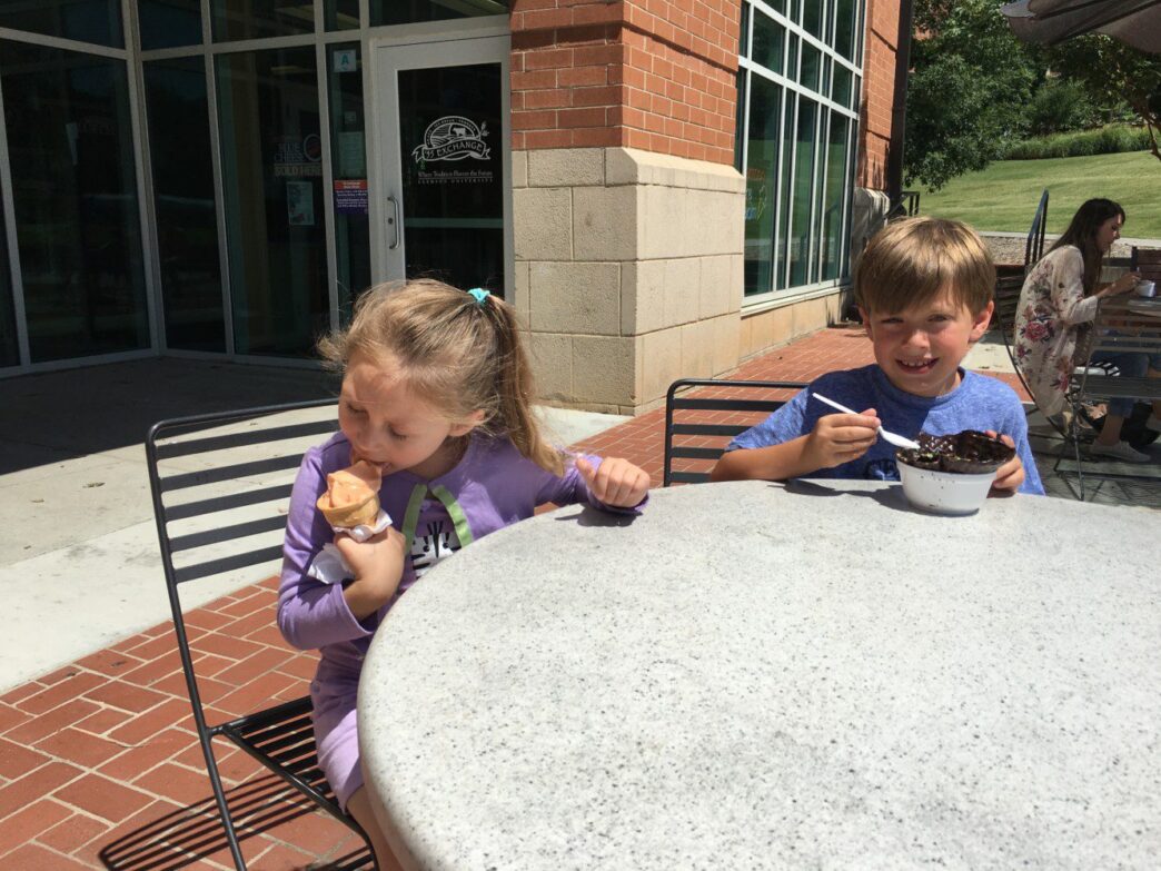 Cousins Olivia Bellinger, 4, of Stanton, Virginia and Wyatt Kilgore, 7, of Franklin, Tennessee, enjoy eating Clemson ice cream from the Class of ’55 Exchange. The Exchange will hold its annual "I Pledge for Ice Cream" from 3 p.m. to 5 p.m. Wednesday, July 3 at the Hendrix Student Center.