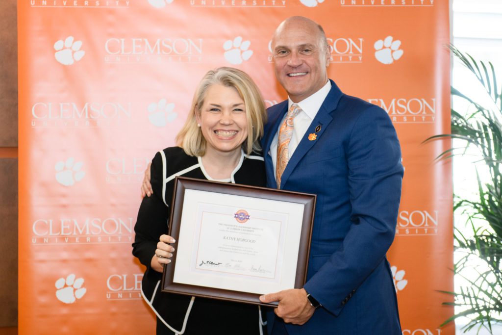 Kathy Hobgood of University Housing & Dining with President James P. Clements at PLI graduation in May 2019.