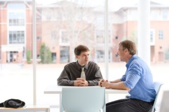 Cole Smith, left, and Laine Mears meet in the Watt Family Innovation Center to talk about the graduate programs they are overseeing and were made possible by the National Science Foundation Research Traineeship Program.