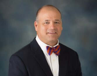 Michael Clark headshot against gray background