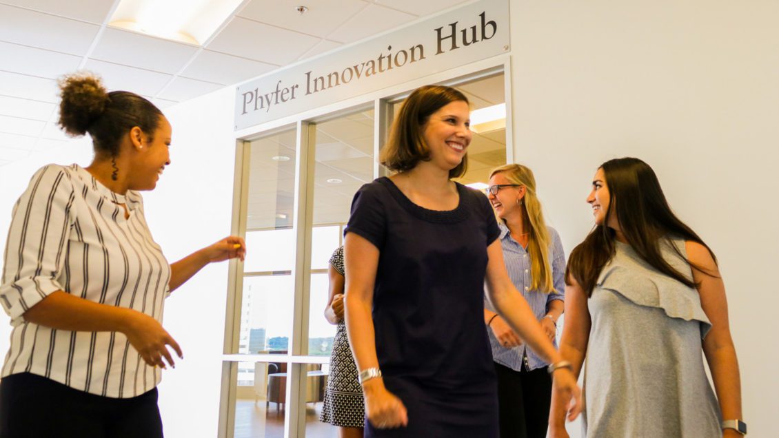 Students mingling outside entrance to Phyfer Innovation Hub
