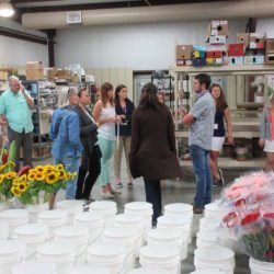 Participants in the 2019 STEM it UP! conference at Clemson learn from industry experts during a visit to Carolina Florist Supply in Anderson.