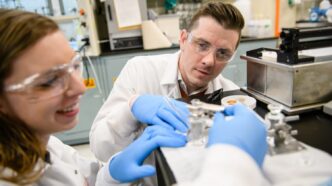 Eric Davis, right, works with a student in Clemson University's Earle Hall.