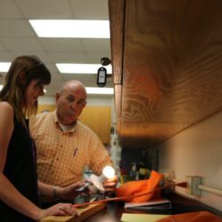 Lights! Lindsey Saxton of Lake Forest HS in Camden, Wyoming successfully builds a single pole switch circuit after receiving instruction from Clemson professor Phil Fravel.