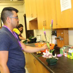 Ramon Quiroga of Gadsden HS in Chamberino, NM creates a floral arrangement during the Introduction to Floral Design Techniques session of the 2019 STEM it UP! conference at Clemson University.