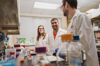 Mark Blenner (center) works in his lab with students Lexie Adams (left) and Will Burnette.
