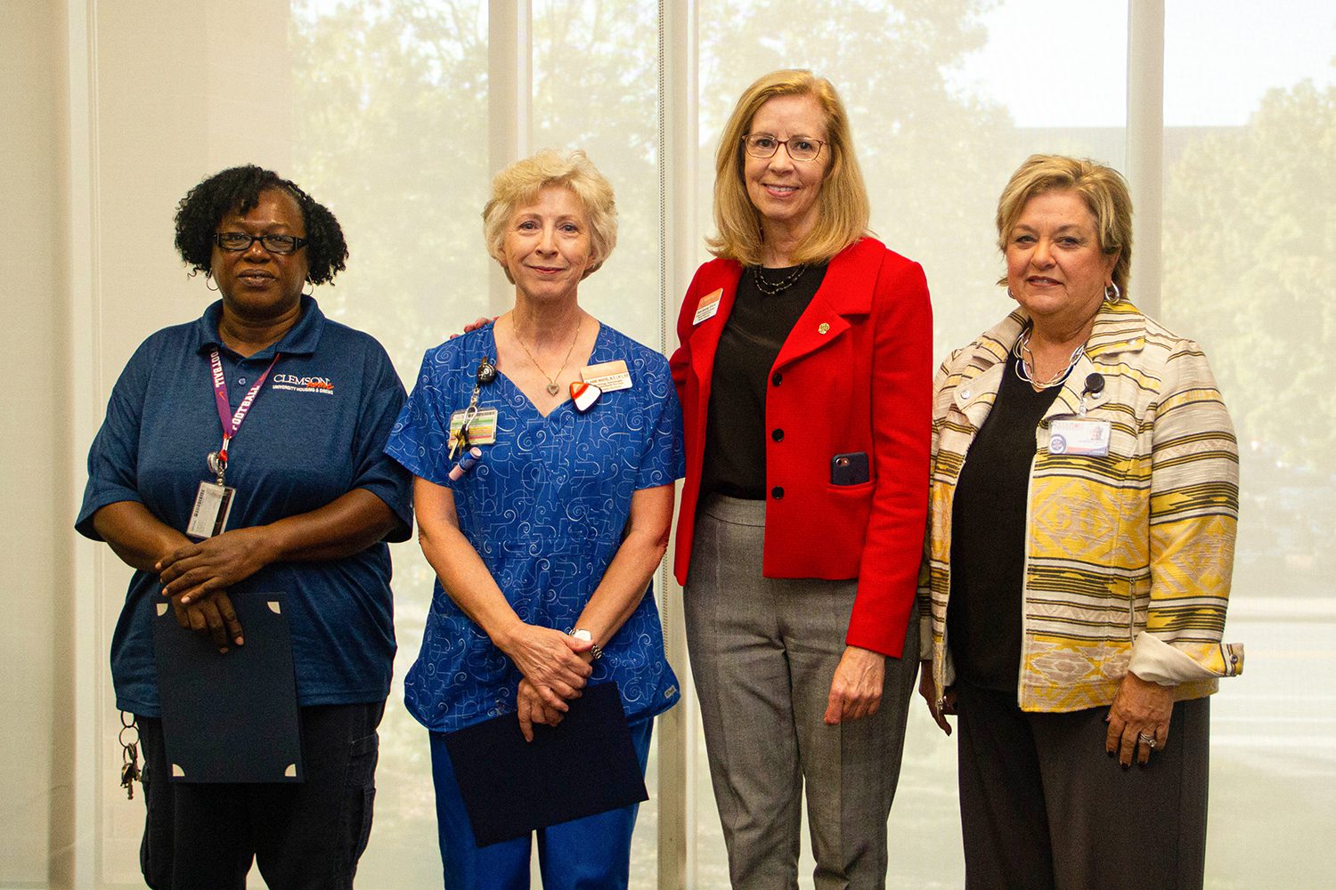 (Left to right) Teresa Estrich, Elaine White and Dede Kearney joined Vice President Almeda Jacks to receive pins and certificates in honor of many years of service to Student Affairs.