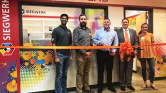 Clemson and Siegwerk reps cut a ribbon at the new Siwegwerk Ink Lab
