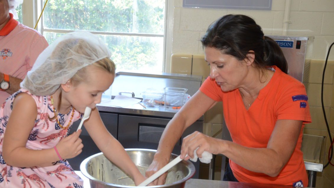 Campbell Czarsty, 4, and Kathleen Swinney make ice cream during Dabo's All In Foundation's Clemson Ice Cream Experience held in the Newman Hall Ice Cream Innovation Lab on Clemson's main campus.