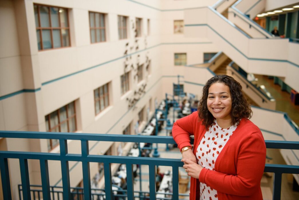 Woman standing in commons area of University
