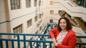 Woman standing in commons area of University