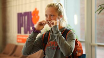 Madi Howell of Clemson volleyball swabbing her cheeks to be added to the Project Life global bone marrow registry