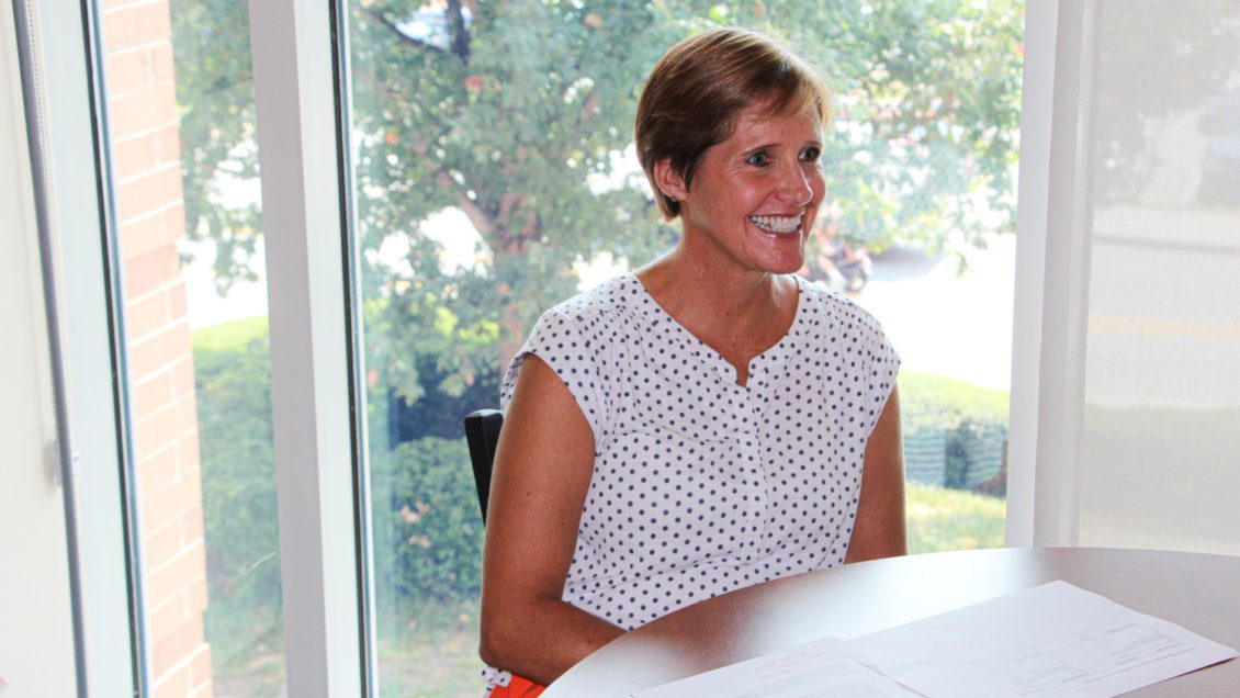 Candid photo of Pam Davis working from her Campus Activities & Events office in Hendrix Student Center in September 2019