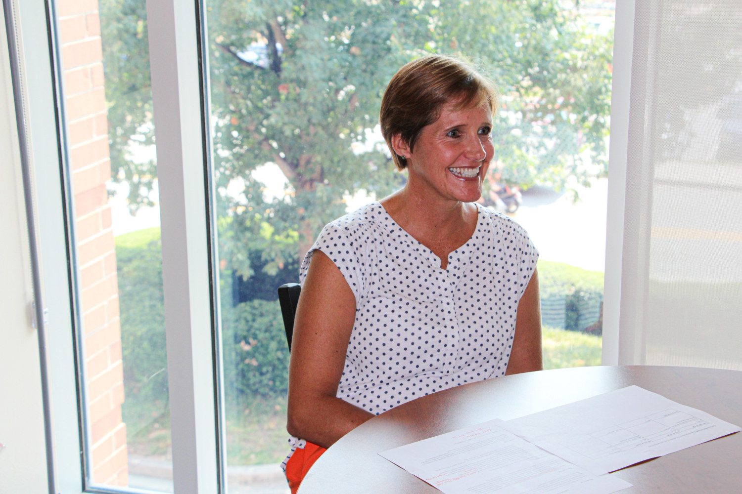 Candid photo of Pam Davis working from her Campus Activities & Events office in Hendrix Student Center in September 2019