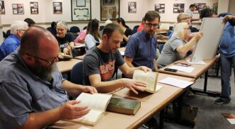 People checking out Remnant Trust collection of old books